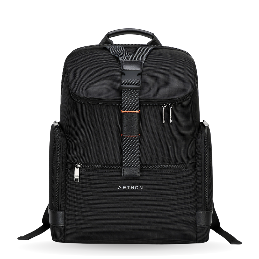 A black Aethon backpack with multiple compartments, featuring a front flap, side pockets, and a visible brand logo.